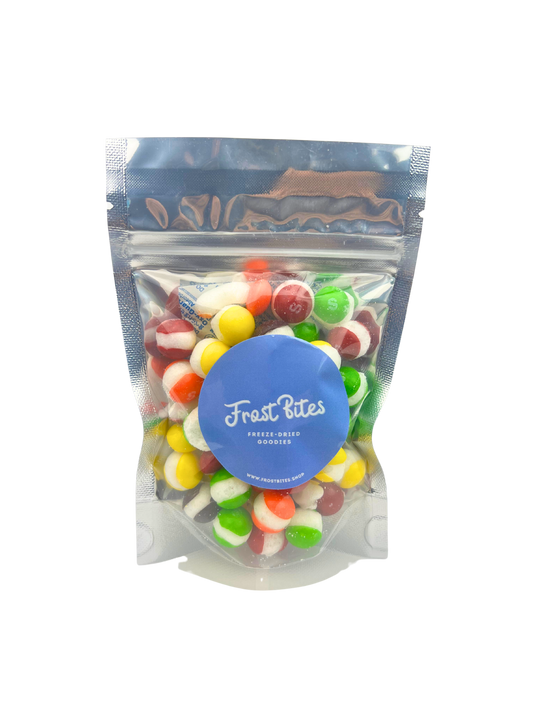 The Rainbow Skits by Frost Bites - Freeze Dried Goodies in a bag with fruit flavors on a white background.