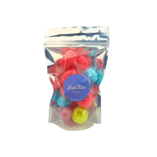 A bag of The Jolly Berry, colorful freeze-dried fruit flavor candy balls in a clear bag by Frost Bites - Freeze Dried Goodies.