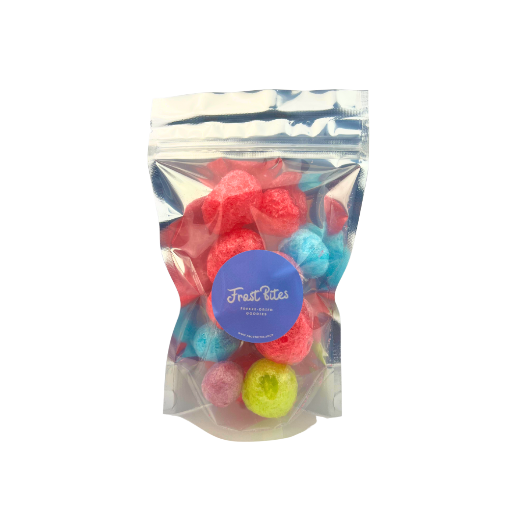 A bag of The Jolly Berry, colorful freeze-dried fruit flavor candy balls in a clear bag by Frost Bites - Freeze Dried Goodies.