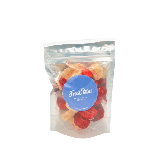 A bag of Frost Bites - Freeze Dried Goodies Strawberry & Banana Bites, a healthy snack, on a white background.